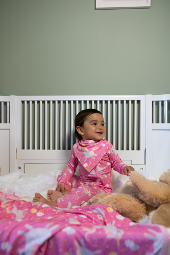 Fairytale Baby in crib wearing a bamboo pyjamas