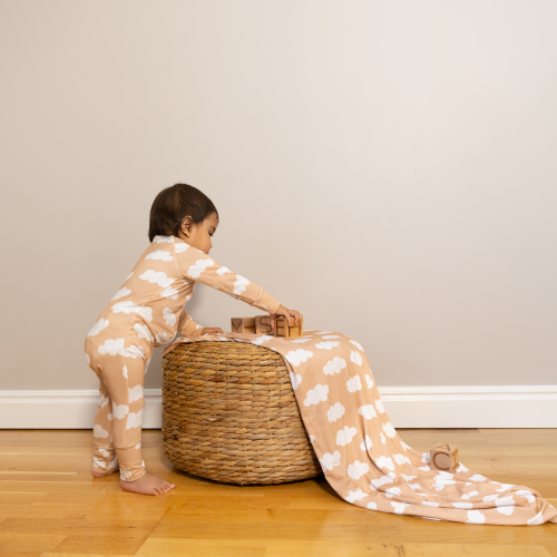 Baby playing in a Kibby soft as a cloud bamboo pyjamas