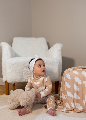 Soft as a cloud Toddler wearing a bamboo soft as a cloud bib while holding her teddybear
